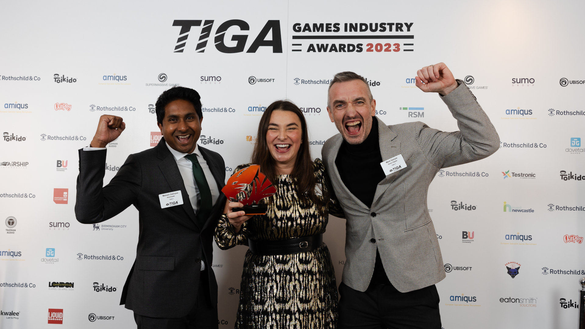 People from Sumo Digital celebrating the&nbsp;Best Large Studio at the TIGA Awards 2023