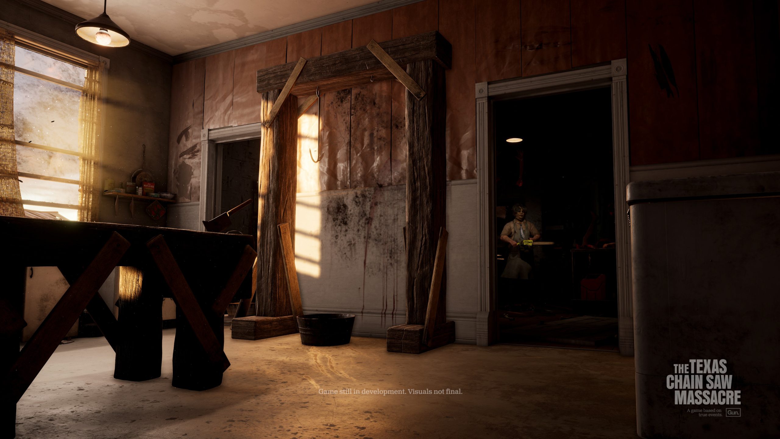 The sun streams through the kitchen window while Leatherface lurks in the shao