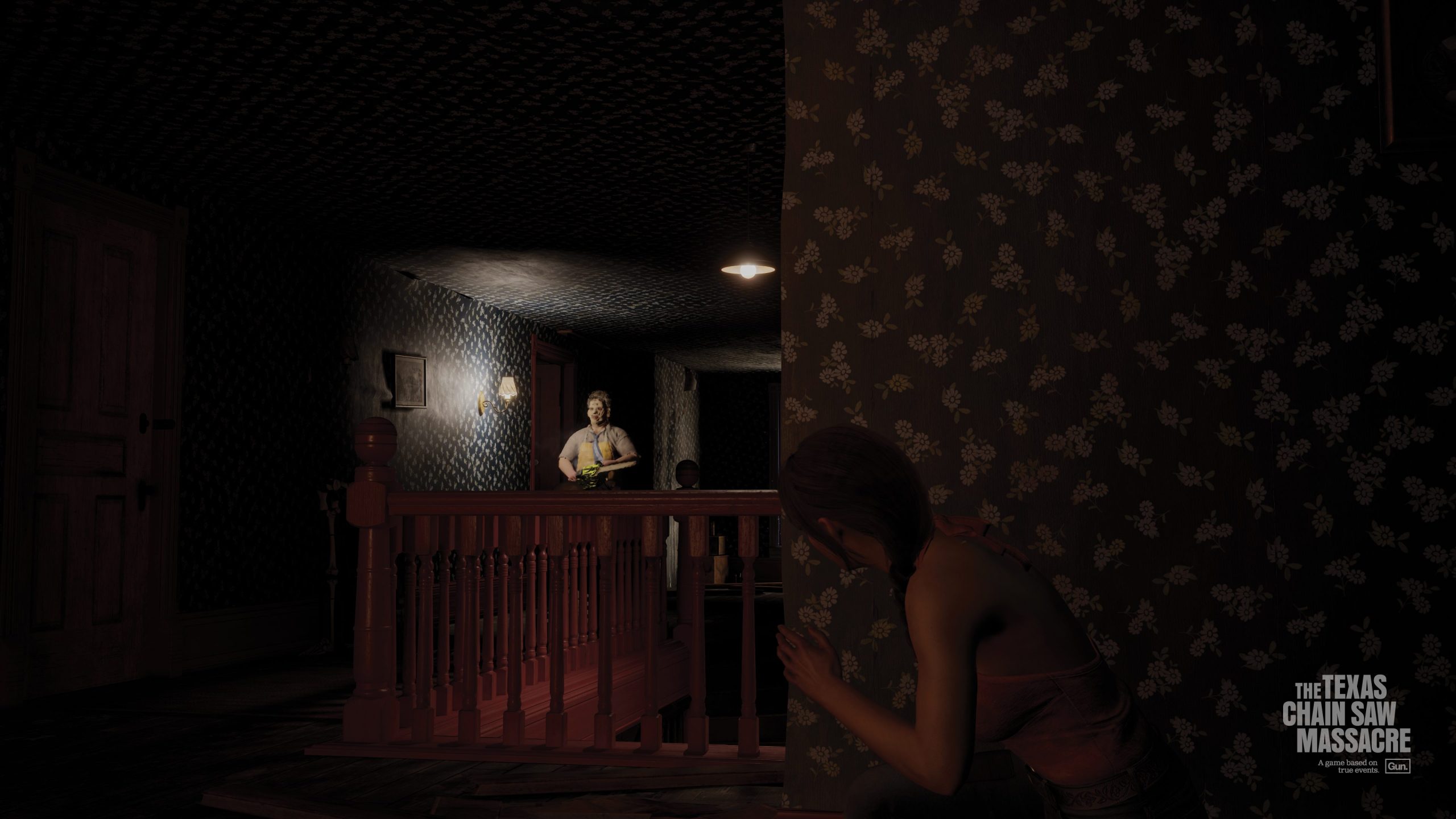 Julie makes her escape while Leatherface lurks in the hallway.