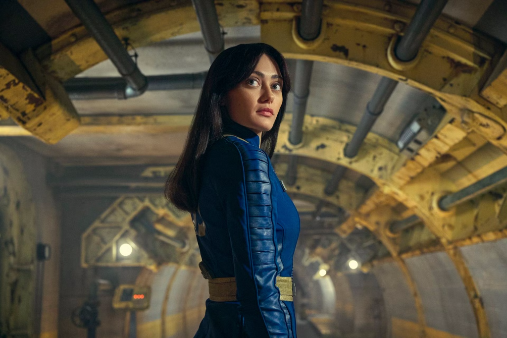 A still from the Fallout TV series. Ella Purnell as Lucy as she prepares to step out of her vault.